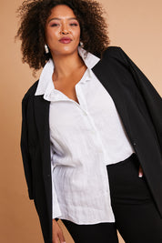 Model Alexis wearing size 16 of the Belle Long Line Ponte Jacket in colour Black (Black), from the front, showing the whole outfit