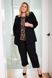 Model Caitlin wearing size 18 of the Belle Long Line Ponte Jacket in colour Black (Black), from the front, showing the whole outfit