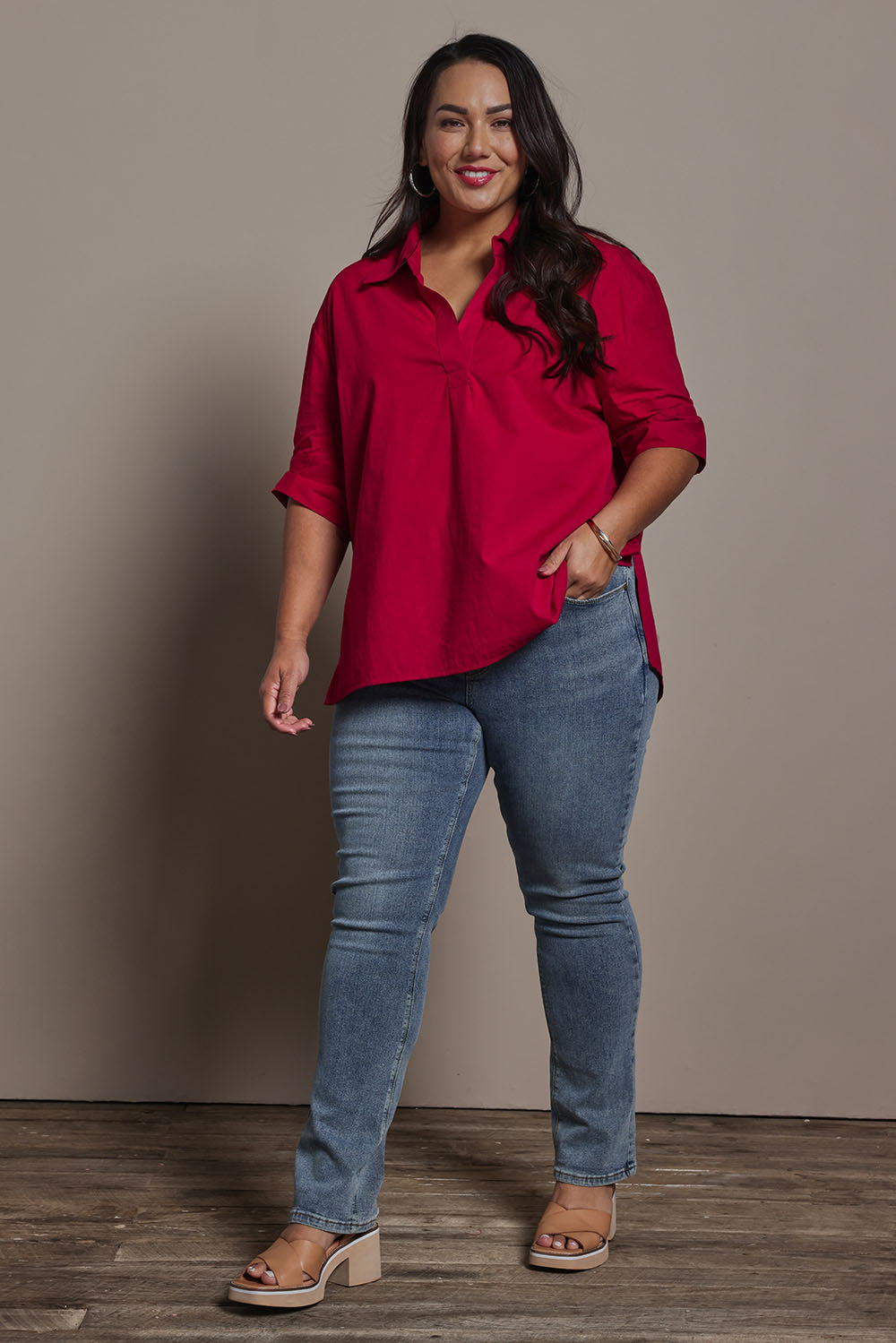 Model Ashleigh wearing size 16 of the Belle Boot Leg Jean in colour Mediumblue (Blue), from the front, showing the whole outfit