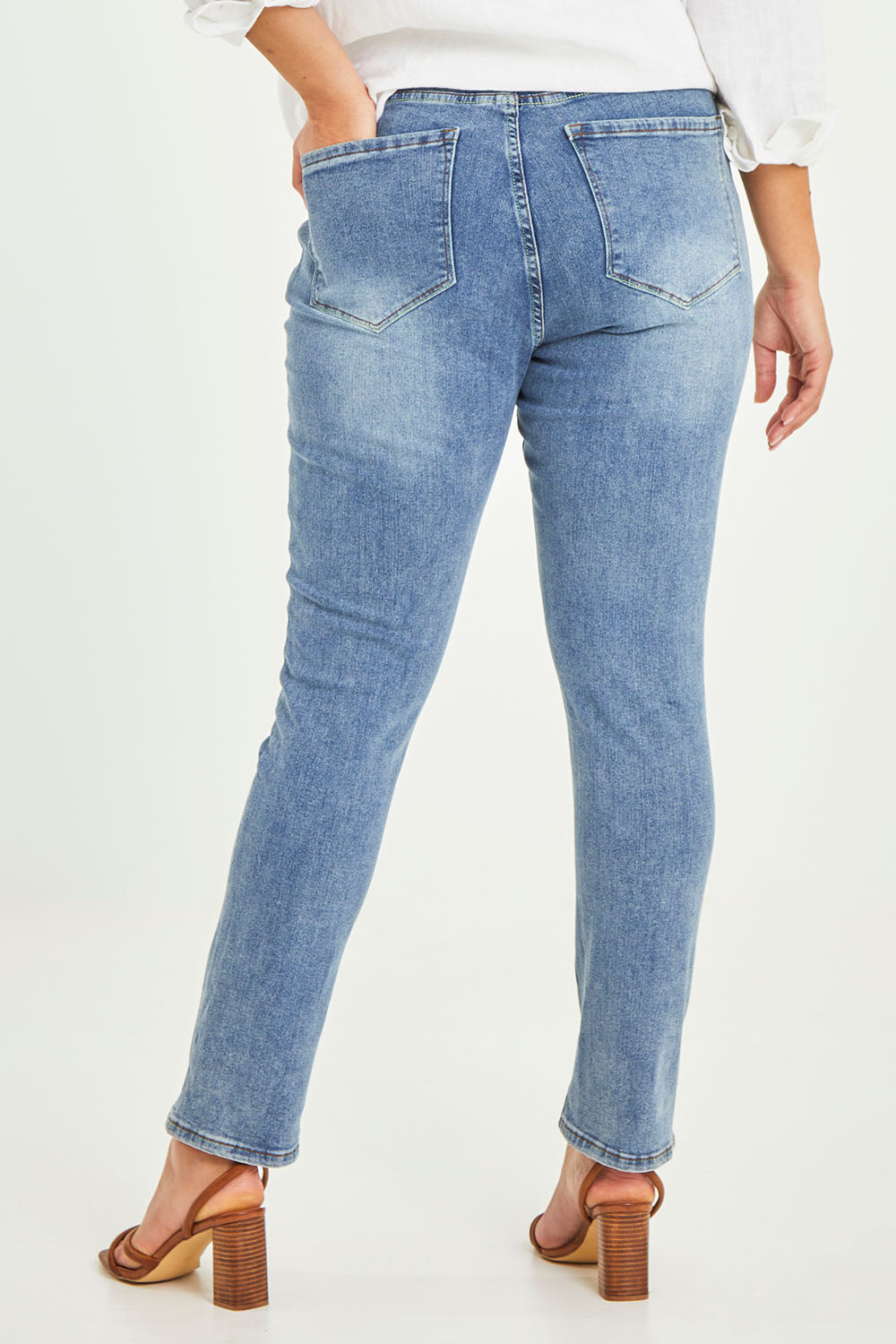 Model Terri-Leigh wearing size 14 of the Belle Boot Leg Jean in colour Mediumblue (Blue), from the back