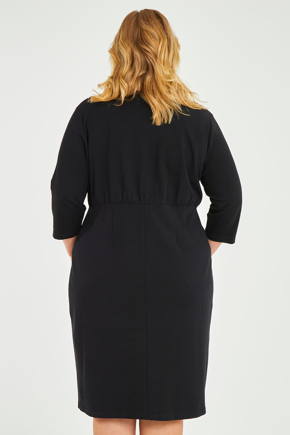 Model Caitlin wearing size 20 of the Belle Ponte Everywear Dress in colour Black (Black), from the back