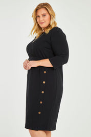 Model Caitlin wearing size 20 of the Belle Ponte Everywear Dress in colour Black (Black), from the front, cropped image