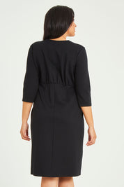 Model Terri-Leigh wearing size 14 of the Belle Ponte Everywear Dress in colour Black (Black), from the back
