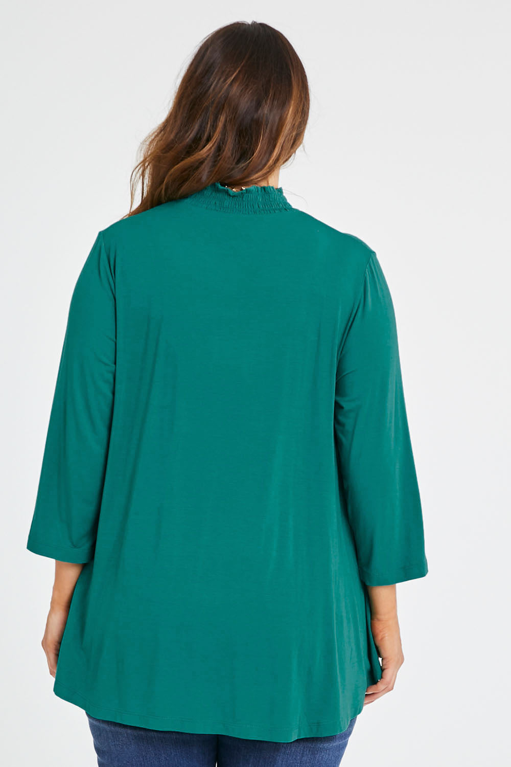 Model Laura wearing size 14 of the Belle Turtleneck Draped Bamboo Tee in colour Teal (Green), from the back