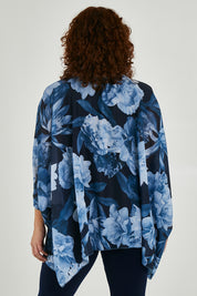 Model Maddy wearing size 16 of the Belle Chiffon Overlay Top in colour Bluefloral (Blue), from the back
