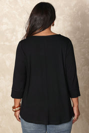 Model Ashleigh wearing size 16 of the Belle Luxe Bamboo Spliced Tee in colour Black (Black), from the back