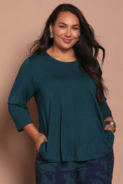 Model Ashleighf wearing size 16 of the Belle Luxe Bamboo Spliced Tee – Deeplagoon in colour Deeplagoon, in a cropped view