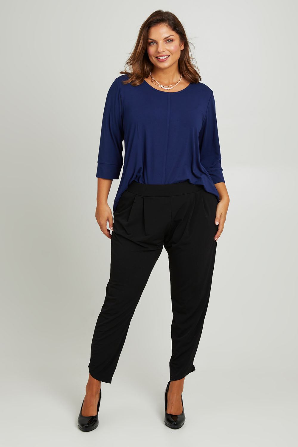 Model Monique wearing size 14 of the Belle Luxe Bamboo Spliced Tee in colour Navy (Blue), from the front, showing the whole outfit