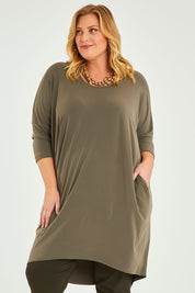 Model Caitlin wearing size 20 of the Belle High Low Easy Wear Dress in colour Khaki (Green), from the front, cropped image