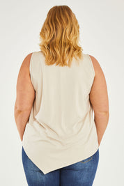 Model Caitlin wearing size 20 of the Belle Asymmetric Luxe Bamboo Tank in colour Straw, from the back