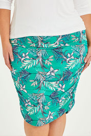 Model Caitlin wearing size 20 of the Belle Lined Side Gathered Skirt in colour Aquafleur (Green), from the front, cropped image