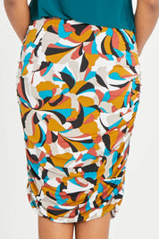 Model Noli wearing size 14 of the Belle Lined Side Gathered Skirt in colour Multiprint, from the back