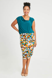Model Noli wearing size 14 of the Belle Lined Side Gathered Skirt in colour Multiprint, from the front, showing the whole outfit