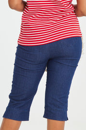 Model Noli wearing size 14 of the Belle 3/4 Length Pull On Jean in colour Denim (Blue), from the back