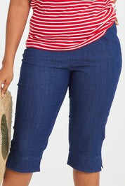Model Noli wearing size 14 of the Belle 3/4 Length Pull On Jean in colour Denim (Blue), from the front, cropped image