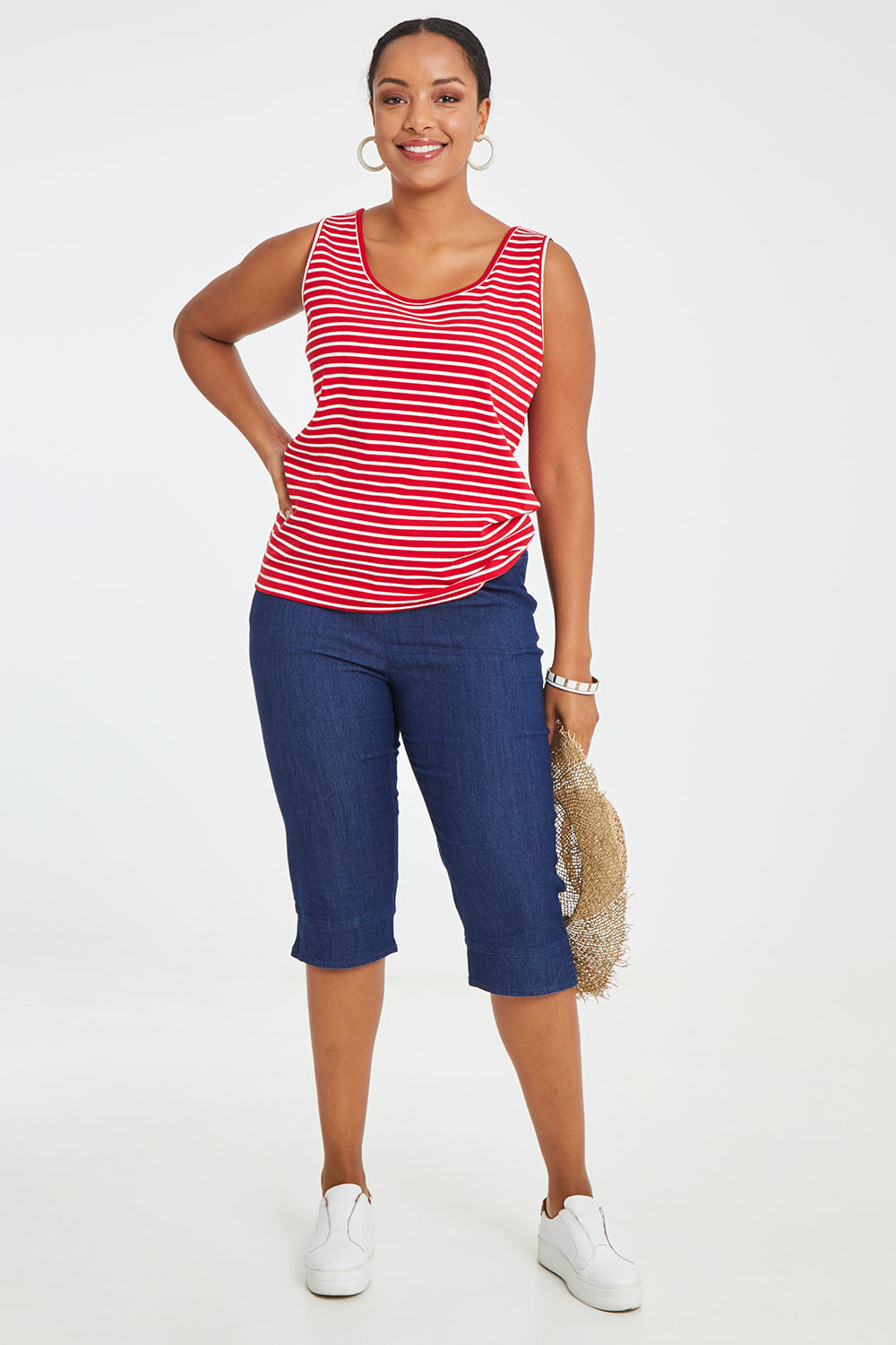 Model Noli wearing size 14 of the Belle 3/4 Length Pull On Jean in colour Denim (Blue), from the front, showing the whole outfit