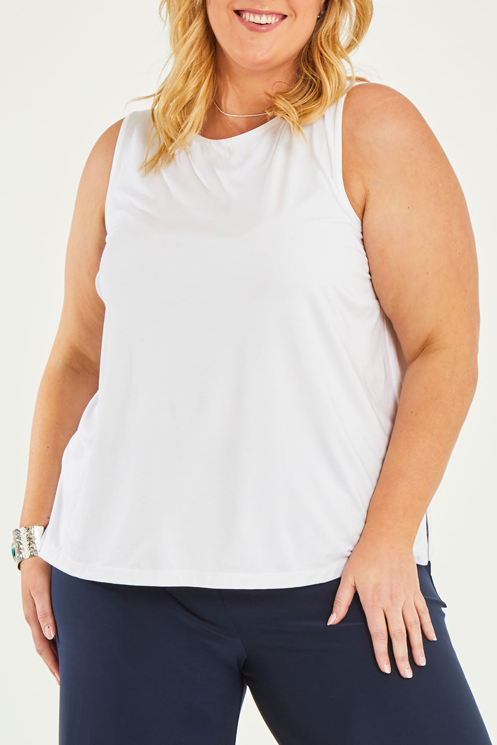 Model Caitlin wearing size 20 of the Belle Luxe Bamboo Tank in colour White (White), from the front, cropped image