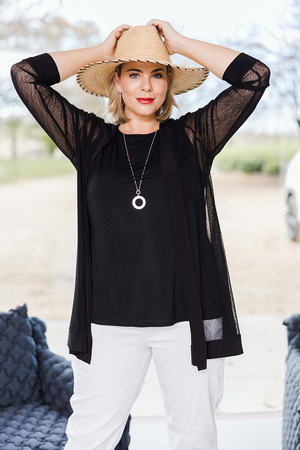 Model Fiona wearing size 16 of the Belle Long Mesh Cardigan in colour Black (Black), from the front, showing the whole outfit