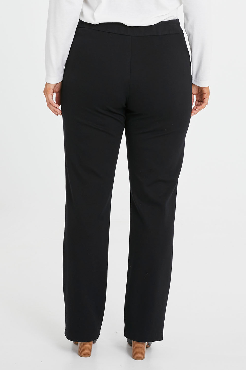 Model Laura wearing size 14 of the Belle Ponte Tailored Pant in colour Black (Black), from the back
