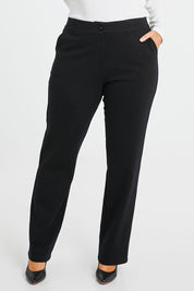 Model Laura wearing size 14 of the Belle Ponte Tailored Pant in colour Black (Black), from the front, cropped image
