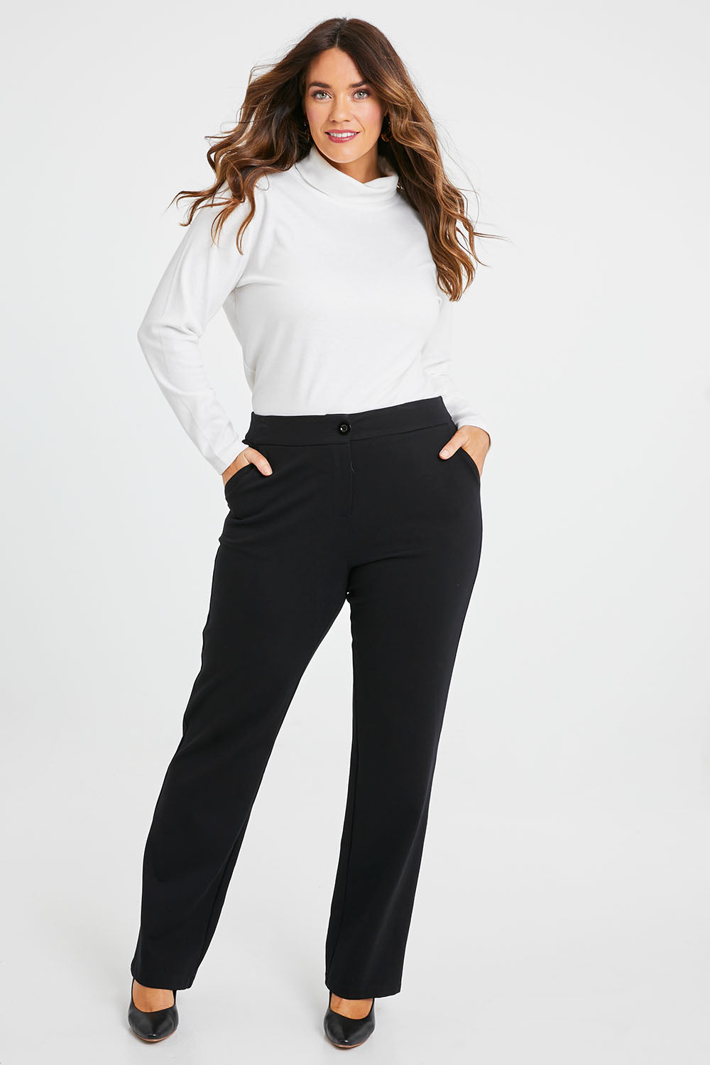 Model Laura wearing size 14 of the Belle Ponte Tailored Pant in colour Black (Black), from the front, showing the whole outfit
