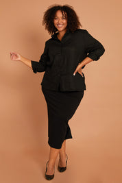 Model Alexis wearing size 16 of the Belle Ponte Maxi Skirt in colour Black (Black), from the front, showing the whole outfit