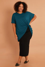 Model Alexis wearing size 16 of the Belle Ponte Maxi Skirt in colour Black (Black), from the front, showing the whole outfit