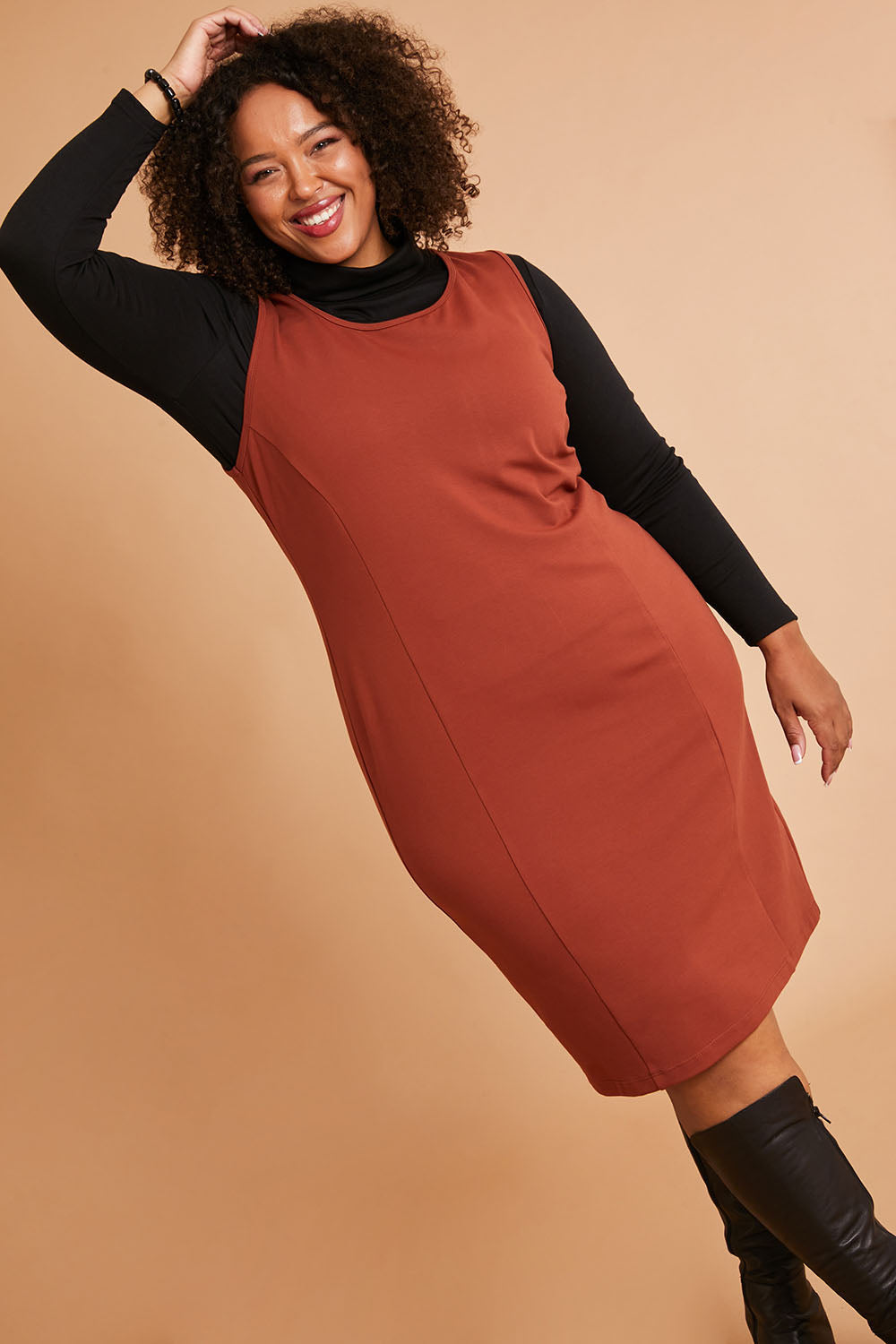 Model Alexis wearing size 16 of the Belle Classic Ponte Sleeveless Dress in colour Ochrerust, from the front, showing the whole outfit
