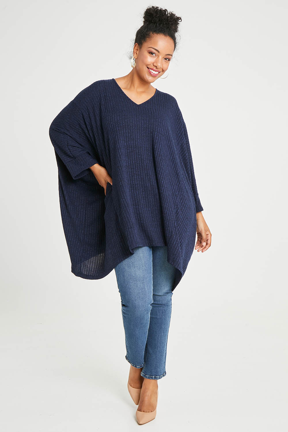 Model Noli wearing size 14 of the Belle Rib Knit Throw Over in colour Navymarle (Blue), from the front, showing the whole outfit