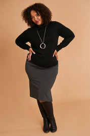 Model Alexis wearing size 16 of the Belle Ponte Pull On Skirt in colour Charcoal (Grey), from the front, showing the whole outfit