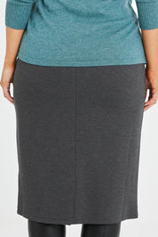 Model Laura wearing size 14 of the Belle Ponte Pull On Skirt in colour Charcoal (Grey), from the back