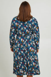 Model Monique wearing size 14 of the Belle Printed Faux Wrap Dress in colour Tealfleur (Green), from the back