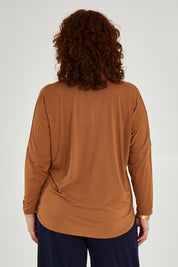 Model Maddy wearing size 16 of the Belle Luxe Bamboo V Neck Tee in colour Tawny, from the back