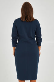 Model Monique wearing size 14 of the Belle Keyhole Ponte Dress in colour Lagoon (Blue), from the back