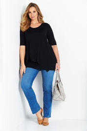 Model Bree wearing size 14 of the Belle Half Sleeve Forgiver Tunic in colour Black (Black), from the front, showing the whole outfit