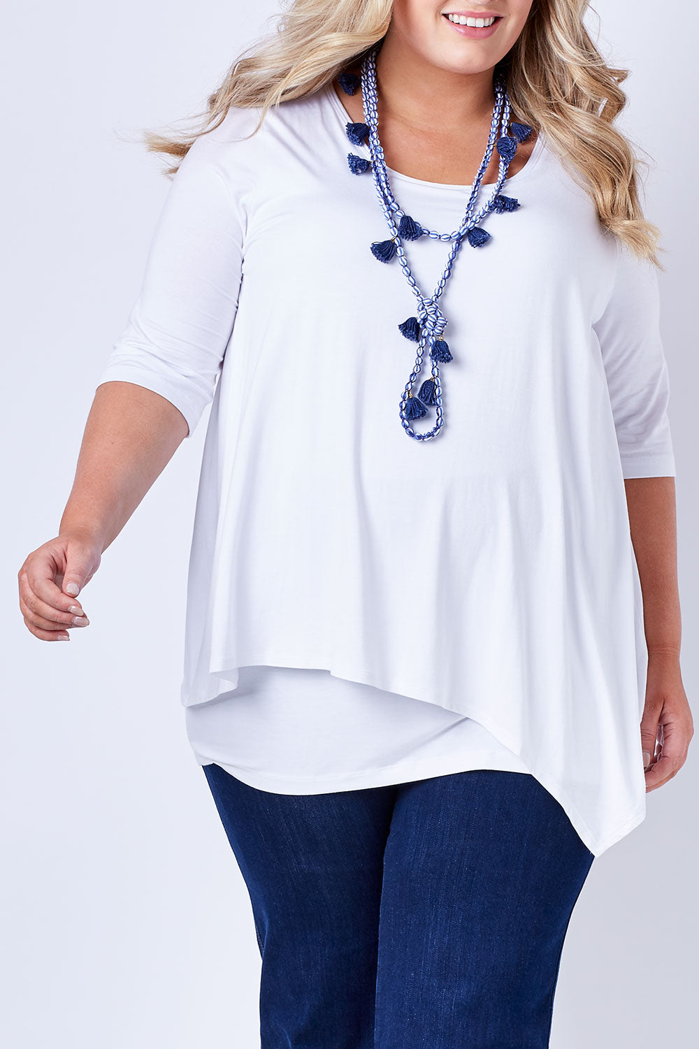 Model Sophie wearing size 20 of the Belle Half Sleeve Forgiver Tunic in colour White (White), from the front, cropped image