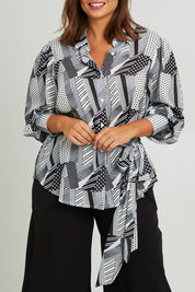 Model Monique wearing size 14 of the Belle Full Sleeve Printed Shirt in colour Blackivory (Black), from the front, cropped image