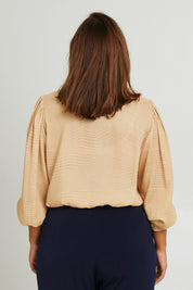 Model Monique wearing size 14 of the Belle Full Sleeve Printed Shirt in colour Tanivory, from the back