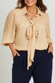Model Monique wearing size 14 of the Belle Full Sleeve Printed Shirt in colour Tanivory, from the front, cropped image