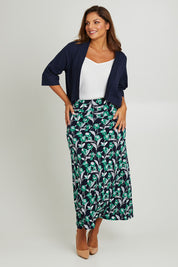 Model Monique wearing size 14 of the Belle Wide Waistband Pull On Skirt in colour Navyfloral (Blue), from the front, showing the whole outfit