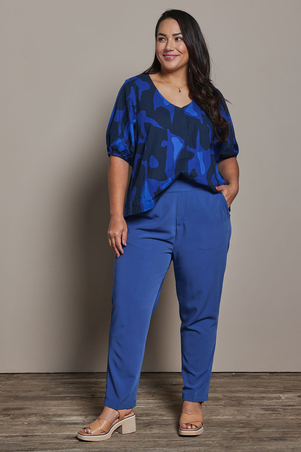 Model Ashleigh wearing size 16 of the Belle Pull On Tailored Soft Suiting  Pant in colour Ink (Blue), from the front, showing the whole outfit