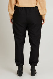Model Laura wearing size 14 of the Belle Pull On Tailored Pant in colour Black (Black), from the back