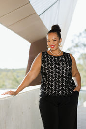 Model Alexis wearing size 18 of the Belle Lined Embroided Tank in colour Black (Black), from the front, showing the whole outfit