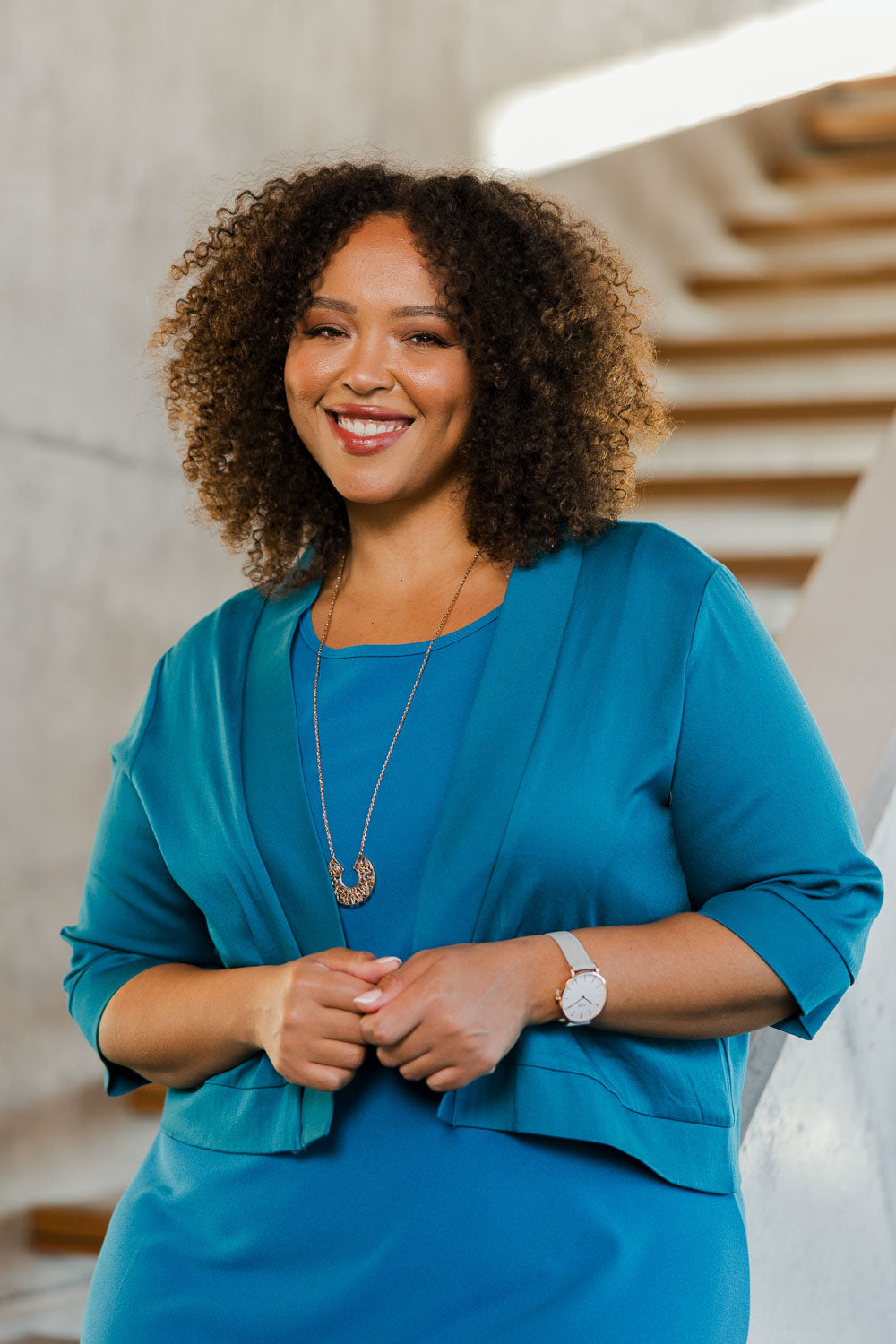 Model Alexis wearing size 18 of the Belle Cotton Sateen Cropped Jacket in colour Jewelblue (Blue), from the front, showing the whole outfit