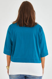 Model Monique wearing size 14 of the Belle Cotton Sateen Cropped Jacket in colour Jewelblue (Blue), from the back