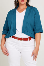 Model Poppy wearing size 16 of the Belle Cotton Sateen Cropped Jacket in colour Jewelblue (Blue), from the front, cropped image