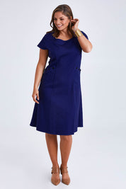 Model Monique wearing size 14 of the Belle A Line Cotton Sateen Dress in colour Sapphire (Blue), from the front, showing the whole outfit