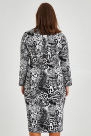 Model Monique wearing size 14 of the Belle Jacquard Knit Dress in colour Greyblack (Grey), from the back