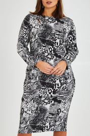 Model Monique wearing size 14 of the Belle Jacquard Knit Dress in colour Greyblack (Grey), from the front, cropped image