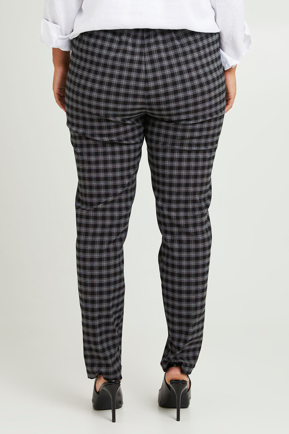 Model Monique wearing size 14 of the Belle Check Pull on Pant in colour Blackwhite (Black), from the back